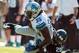 November 4, 2012; Jacksonville, FL, USA; Detroit Lions running back Joique Bell (35) gets tackled by Jacksonville Jaguars cornerback Mike Harris (20) during the first half of the game at EverBank Field. The Lions defeated the Jaguars 31-14. Mandatory Credit: Rob Foldy-US PRESSWIRE