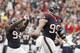 HOUSTON, TX- SEPTEMBER 30: J.J. Watt #99 of the Houston Texans and Antonio Smith #94 of the Houston Texans celebrate a fumble recovery against the Tennessee Titans defense on September 30, 2012 at Reliant Stadium in Houston, Texas. Houston Texans won 38 to 14. (Photo by Thomas B. Shea/Getty Images)