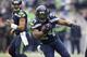 SEATTLE, WA - NOVEMBER 04: Marshawn Lynch #24 of the Seattle Seahawks rushes the ball against the Minnesota Vikings during play at CenturyLink Field on November 4, 2012 in Seattle, Washington. in the background is Russell Wilson #3 of the Seattle Seahawks. (Photo by Stephen Brashear/Getty Images)