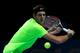 LONDON, ENGLAND - NOVEMBER 10: Juan Martin Del Potro of Argentina returns a shot during his men's singles match against Roger Federer of Switzerland during day six of the ATP World Tour Finals at O2 Arena on November 10, 2012 in London, England. (Photo by Julian Finney/Getty Images)