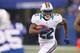 INDIANAPOLIS, IN - NOVEMBER 04: Reggie Bush #22 of the Miami Dolphins looks for running room while playing the Indianapolis Colts at Lucas Oil Stadium on November 4, 2012 in Indianapolis, Indiana. (Photo by Gregory Shamus/Getty Images)