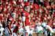 Nov 10, 2012; Norman, OK, USA; Oklahoma Sooners quarterback Landry Jones (12) looks to the sidelines for the play call in the first half of the game against the Baylor Bears at Oklahoma Memorial Stadium. Mandatory Credit: Denny Medley-US PRESSWIRE