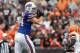CLEVELAND, OH - SEPTEMBER 23: Tight end Scott Chandler #84 of the Buffalo Bills makes a catch in front of T.J. Ward #43 of the Cleveland Browns at Cleveland Browns Stadium on September 23, 2012 in Cleveland, Ohio. (Photo by Matt Sullivan/Getty Images)