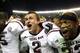 TUSCALOOSA, AL - NOVEMBER 10: Quarterback Johnny Manziel #2, defensive back Dustin Harris #22 and wide receiver Kenric McNeal #5 of the Texas A&M Aggies celebrate after the game against the Alabama Crimson Tide Texas A&M Aggies at Bryant-Denny Stadium on November 10, 2012 in Tuscaloosa, Alabama. The Aggies beat the Crimson Tide 29-24. (Photo by Mike Zarrilli/Getty Images)