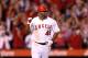 ANAHEIM, CA - SEPTEMBER 26: Torii Hunter #48 of the Los Angeles Angels of Anaheim celebrates as he runs to first base on his walk off RBI single in the ninth inning to win the game against the Seattle Mariners at Angel Stadium of Anaheim on September 26, 2012 in Anaheim, California. The Angels won 4-3. (Photo by Stephen Dunn/Getty Images)