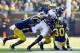 November 10, 2012; Ann Arbor, MI, USA; Northwestern Wildcats wide receiver Cameron Dickerson (19) is tackled by Michigan Wolverines safety Thomas Gordon (30) , linebacker Jake Ryan (center) and cornerback J.T. Floyd (left) in the fourth quarter at Michigan Stadium. Mandatory Credit: Rick Osentoski-US PRESSWIRE