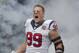 HOUSTON,TX - SEPTEMBER 09: J.J. Watt #99 of the Houston Texans is introduced to the crowd before playing the Miami Dolphins at Reliant Stadium on September 9, 2012 in Houston, Texas. (Photo by Bob Levey/Getty Images)