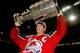 11 Jun 1996: Joe Sakic, captain of the Colorado Avalanche carries the Stanley Cup trophy after defeating the Florida Panthers 1-0 in triple overtime of game four of the Stanley Cup Finals at Miami Arena in Miami, Florida. Sakic was awarded the Conn Smythe