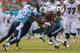 MIAMI GARDENS, FL - NOVEMBER 11: Daniel Thomas #33 of the Miami Dolphins is tackeled by Michael Griffin #33 of the Tennessee Titans during a game at Sun Life Stadium on November 11, 2012 in Miami Gardens, Florida. (Photo by Mike Ehrmann/Getty Images)