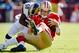 SAN FRANCISCO, CA - NOVEMBER 11: Quarterback Alex Smith #11 of the San Francisco 49ers gets hit by linebacker Jo-Lonn Dunbar #52 of the St. Louis Rams during a run in the first quarter on November 11, 2012 at Candlestick Park in San Francisco, California. (Photo by Brian Bahr/Getty Images)