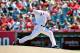September 9, 2012; Anaheim, CA, USA; Los Angeles Angels starting pitcher Zack Greinke (23) pitches in the fifth inning against the Detroit Tigers at Angel Stadium. Mandatory Credit: Gary A. Vasquez-US PRESSWIRE