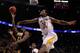 PORTLAND, OR - MARCH 15: Treveon Graham #21 of the Virginia Commonwealth Rams goes up for a shot against Carl Hall #22 of the Wichita State Shockers in the second round of the 2012 NCAA men's basketball tournament at Rose Garden Arena on March 15, 2012 in Portland, Oregon. (Photo by Jonathan Ferrey/Getty Images)