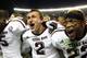 TUSCALOOSA, AL - NOVEMBER 10: Quarterback Johnny Manziel #2, defensive back Dustin Harris #22 and wide receiver Kenric McNeal #5 of the Texas A&M Aggies celebrate after the game against the Alabama Crimson Tide Texas A&M Aggies at Bryant-Denny Stadium on November 10, 2012 in Tuscaloosa, Alabama. The Aggies beat the Crimson Tide 29-24. (Photo by Mike Zarrilli/Getty Images)