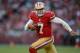 SAN FRANCISCO, CA - NOVEMBER 11: Colin Kaepernick #7 of the San Francisco 49ers runs around right end for seven yards and scores a touchdown against the St. Louis Rams in the fourth quarter of an NFL football game at Candlestick Park on November 11, 2012 in San Francisco, California. The game ended after sudden death overtime in a 24-24 tie. (Photo by Thearon W. Henderson/Getty Images)