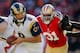 SAN FRANCISCO, CA - NOVEMBER 11: Quarterback Sam Bradford #8 of the St. Louis Rams turns to hand the ball off under pressure from Safety Donte Whitner #31 of the San Francisco 49ers in the second half on November 11, 2012 at Candlestick Park in San Francisco, California. The teams tied 24-24 in overtime. (Photo by Brian Bahr/Getty Images)