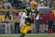 GREEN BAY, WI - NOVEMBER 04: Aaron Rodgers #12 of the Green Bay Packers rolls out to look for a receiver against the Arizona Cardinals at Lambeau Field on November 4, 2012 in Green Bay, Wisconsin. The Packers defeated the Cardinals 31-17. (Photo by Jonathan Daniel/Getty Images)