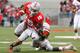 COLUMBUS, OH - NOVEMBER 03: Devin Smith #15 of the Ohio State Buckeyes is tackled by Terry Hawthorne #1 of the Illinois Illini on November 3, 2012 at Ohio Stadium in Columbus, Ohio. Ohio State defeated Illinois 52-22. (Photo by Kirk Irwin/Getty Images)