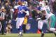 ORCHARD PARK, NY - DECEMBER 18: Ryan Fitzpatrick #14 of the Buffalo Bills throws a deep pass during their NFL game against the Miami Dolphins at Ralph Wilson Stadium on December 18, 2011 in Orchard Park, New York. (Photo by Tom Szczerbowski/Getty Images)