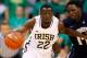 SOUTH BEND, IN - NOVEMBER 12: Jerian Grant #22 of the Notre Dame Fighting Irish brings the ball up court during the game as Tyrone O'Garro #14 of the Monmouth Hawks defends at Purcel Pavilion on November 12, 2012 in South Bend, Indiana. Notre Dame defeated Monmouth 84-57. (Photo by Michael Hickey/Getty Images)