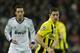 MADRID, SPAIN - NOVEMBER 06: Robert Lewandowski of Borussia Dortmund controls the ball backdropped by Mesut Ozil of Real Madrid during the UEFA Champions League group D match between Real Madrid and Borussia Dortmund at Estadio Santiago Bernabeu on November 6, 2012 in Madrid, Spain. (Photo by Jasper Juinen/Getty Images)