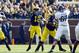 November 10, 2012; Ann Arbor, MI, USA; Michigan Wolverines quarterback Devin Gardner (12) passes the ball as offensive linesman Ricky Barnum (52) blocks Northwestern Wildcats defensive lineman Sean McEvilly (67) in the fourth quarter at Michigan Stadium. Mandatory Credit: Rick Osentoski-US PRESSWIRE