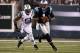 EAST RUTHERFORD, NJ - AUGUST 26: Cam Newton #1 of the Carolina Panthers runs from Aaron Maybin #51 of the New York Jets during their preseason game at MetLife Stadium on August 26, 2012 in East Rutherford, New Jersey. (Photo by Jeff Zelevansky/Getty Images)