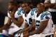 CHARLOTTE, NC - AUGUST 17: Mike Tolbert #34 of the Carolina Panthers sits with teammates DeAngelo Williams #34 and Jonathan Stewart #28 during their preseason game against the Miami Dolphins at Bank of America Stadium on August 17, 2012 in Charlotte, North Carolina. (Photo by Streeter Lecka/Getty Images)