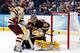 TAMPA, FL - APRIL 05: Goalie Kent Patterson #35 of the Minnesota Gophers deflects the puck as Johnny Gaudreau #13 of the Boston College Eagles shoots during the NCAA Division 1 Men's Hockey Championship Semifinal Game at the Tampa Bay Times Forum on April 5, 2012 in Tampa, Florida. (Photo by J. Meric/Getty Images)