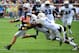 ATLANTA, GA - OCTOBER 27: Riley Nelson #13 of the BYU Cougars carries the ball against Brandon Watts #11 and Anthony Harrell #51 of the Georgia Tech Yellow Jackets at Bobby Dodd Stadium on October 27, 2012 in Atlanta, Georgia. (Photo by Scott Cunningham/Getty Images)