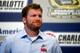 CHARLOTTE, NC - OCTOBER 11: Dale Earnhardt Jr. speaks to the media at Charlotte Motor Speedway on October 11, 2012 in Charlotte, North Carolina. Earnhardt will miss two races after suffering a concussion from a wreck in Talladega last week. (Photo by Chris Graythen/Getty Images)