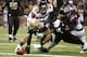 NEW ORLEANS, LA - NOVEMBER 11: Marques Colston #12 of the New Orleans Saints stretches for yardage while being held by Thomas DeCoud #28 and Dunta Robinson #23 of the Atlanta Falcons at Mercedes-Benz Superdome on November 11, 2012 in New Orleans, Louisiana. The Saints defeated the Falcons 31-27. (Photo by Wesley Hitt/Getty Images)