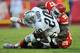 KANSAS CITY, MO - OCTOBER 28: Defensive linemen Allen Bailey #97 of the Kansas City Chiefs tackles running back Darren McFadden #20 of the Oakland Raiders for a loss during the fourth quarter on October 28, 2012 at Arrowhead Stadium in Kansas City, Missouri. Oakland defeated Kansas City 26-16. (Photo by Peter Aiken/Getty Images)