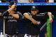 MIAMI, FL - JULY 27: Josh Johnson #55 and Mark Buehrle #56 iof the Miami Marlins watch the action from the dugout in the ninth inning during a game against the San Diego Padres at Marlins Park on July 27, 2012 in Miami, Florida. The Padres defeated the Marlins 7-2. (Photo by Sarah Glenn/Getty Images)