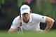 HONG KONG - NOVEMBER 15: Rory McIlroy of Northern Ireland lines up a putt during the first round of the UBS Hong Kong open at The Hong Kong Golf Club on November 15, 2012 in Hong Kong, Hong Kong. (Photo by Stuart Franklin/Getty Images)