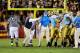 LOS ANGELES, CA - NOVEMBER 28: Rick Neuheisel head coach of the UCLA Bruins restrains his players after they nearly had an all-out fight with USC Trojans at the end of the NCAA college football game at Los Angeles Memorial Coliseum on November 28, 2009 in Los Angeles, California. (Photo by Kevork Djansezian/Getty Images)