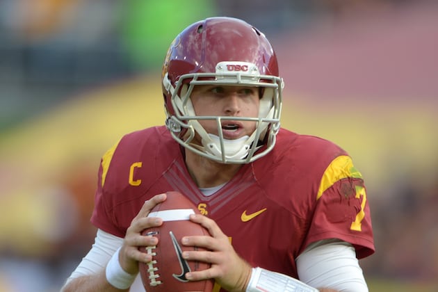 UCLA's Jerry Neuheisel Takes on Opponent Matt Barkley