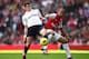 LONDON, ENGLAND - FEBRUARY 26: Gareth Bale of Tottenham Hotspur is challenged by Theo Walcott of Arsenal during the Barclays Premier League match between Arsenal and Tottenham Hotspur at Emirates Stadium on February 26, 2012 in London, England. (Photo by Clive Mason/Getty Images)
