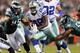 PHILADELPHIA, PA - NOVEMBER 11: Felix Jones #28 of the Dallas Cowboys carries the ball as Mychal Kendricks #95 and DeMeco Ryans #59 of the Philadelphia Eagles defend on November 11, 2012 at Lincoln Financial Field in Philadelphia, Pennsylvania. (Photo by Elsa/Getty Images)