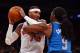 Carmelo Anthony battling a defender