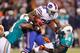 ORCHARD PARK, NY - NOVEMBER 15: C.J. Spiller #28 of the Buffalo Bills runs against Cameron Wake #91 and Karlos Dansby #58 of the Miami Dolphins at Ralph Wilson Stadium on November 15, 2012 in Orchard Park, New York. (Photo by Rick Stewart/Getty Images)