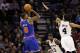 Nov 15, 2012; San Antonio, TX, USA; New York Knicks guard J.R. Smith (8) shoots while being defended by San Antonio Spurs guard Danny Green (4) during the first half at the AT&T Center. Mandatory Credit: Soobum Im-US PRESSWIRE