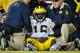 LINCOLN, NE - OCTOBER 27: Quarterback Denard Robinson #16 of the Michigan Wolverines is attended to by trainers after being injured during their game against the Nebraska Cornhuskers at Memorial Stadium on October 27, 2012 in Lincoln, Nebraska. (Photo by Eric Francis/Getty Images)