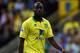 NORWICH, ENGLAND - AUGUST 25: Sebastien Bassong of Norwich City in action during the Barclays Premier League match between Norwich City and Queens Park Rangers at Carrow Road on August 25, 2012 in Norwich, England. (Photo by Matthew Lewis/Getty Images)
