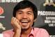 BEVERLY HILLS, CA - SEPTEMBER 17: Boxer Manny Pacquiao laughs during the Manny Pacquiao v Juan Manuel Marquez - Press Conference at Beverly Hills Hotel on September 17, 2012 in Beverly Hills, California. (Photo by Victor Decolongon/Getty Images)