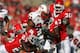 PISCATAWAY, NJ - SEPTEMBER 29: Jason McCourty #25 and Ron Girault #43 of the Rutgers Scarlet Knights tackle Da'Rel Scott #23 of the Maryland Terrapins during their game at Rutgers Stadium on September 29, 2007 in Piscataway, New Jersey. (Photo by Nick Laham/Getty Images)