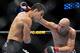 DALLAS - SEPTEMBER 19: UFC fighter Rafael Dos Anjos (L) battles UFC fighter Rob Emerson (R) during their Lightweight bout at UFC 103: Franklin vs. Belfort at the American Airlines Center on September 19, 2009 in Dallas, Texas. (Photo by Jon Kopaloff/Getty Images)