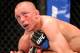 Nov 17, 2012; Montreal, QC, Canada; Georges St-Pierre (top) checks the remaining time left in the fifth round in his Welterweight Championship bout against Carlos Condit (bottom) at UFC 154 at the Bell Centre. St-Pierre defeated Condit by unanimous decision. Mandatory Credit: Eric Bolte-US PRESSWIRE