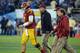 PASADENA, CA - NOVEMBER 17: Matt Barkley #7 of the USC Trojans is escorted off the field after a sack by the UCLA Bruins at Rose Bowl on November 17, 2012 in Pasadena, California. The UCLA Bruins beat the USC Trojans 38-28. (Photo by Harry How/Getty Images)