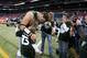 ST. LOUIS, MO - NOVEMBER 18: Quarterback Tim Tebow #15 of the New York Jets meets Christian, a member of the Tim Tebow Foundation, prior to the game against the St. Louis Rams at the Edward Jones Dome on November 18, 2012 in St. Louis, Missouri. (Photo by David Welker/Getty Images)