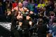 Photo: WWE.com (Dean Ambrose, Seth Rollins and Roman Reigns put Ryback through a table)